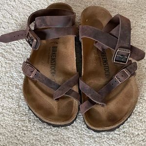 Birkenstocks size 37.  Dark brown leather.